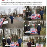 Na płocie cmentarza plakat Andrzeja Dudy, przy nim wiceprezydent Katowic zbierający podpisy. Zasłonił się ulotką Nestle
